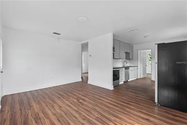 a view of kitchen with wooden floor