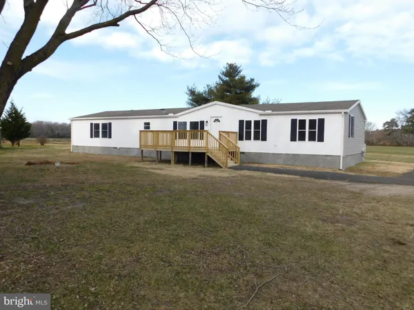 a house that has a tree in front of it