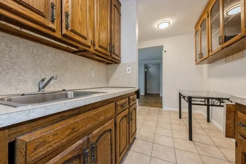 a kitchen with stainless steel appliances granite countertop a sink and cabinets