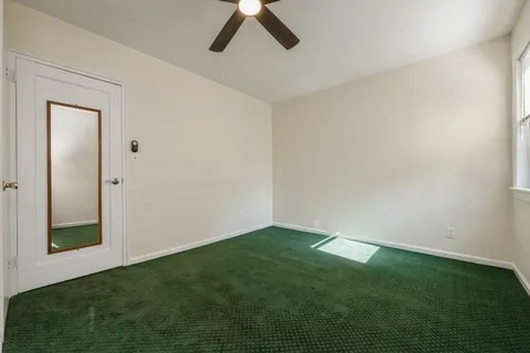 a view of empty room with fan