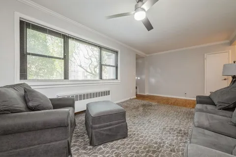 a living room with furniture and a window