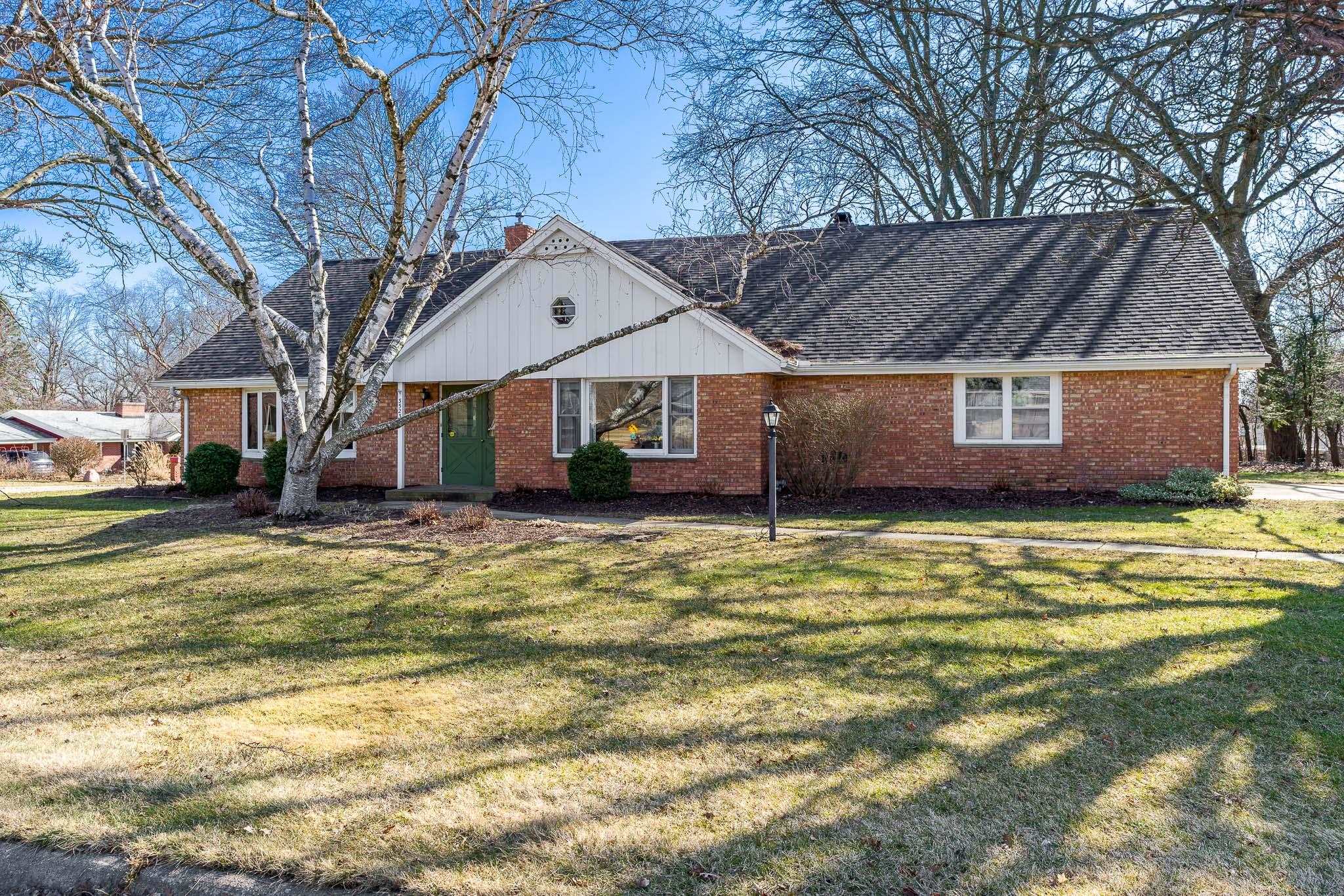 3523 North View Road Rockford, IL 61107 - Photo 1 of 59 a front view of a house with a garden