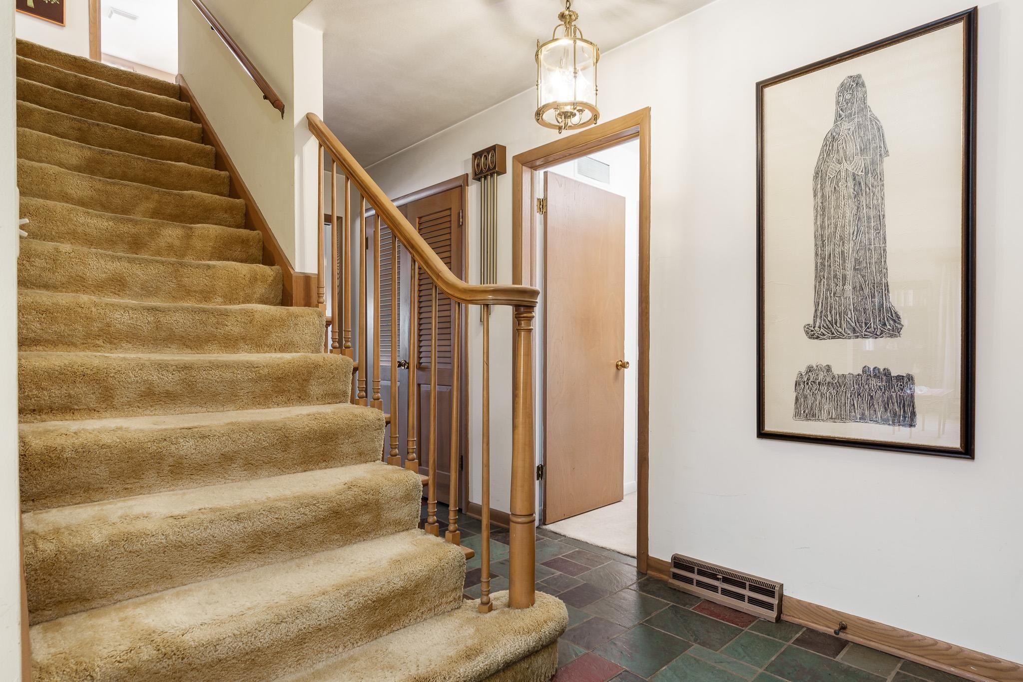 3523 North View Road Rockford, IL 61107 - Photo 7 of 59 a view of staircase with white walls and black walls