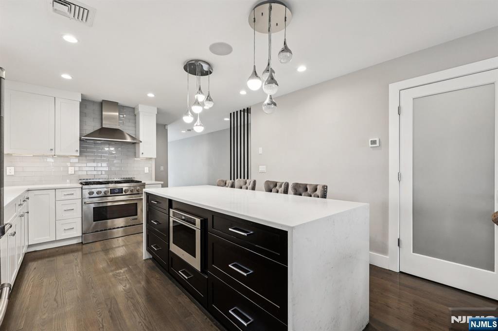 746 Undercliff Avenue, Unit B Edgewater, NJ 07020 - Photo 12 of 50 a kitchen with a stove and a refrigerator