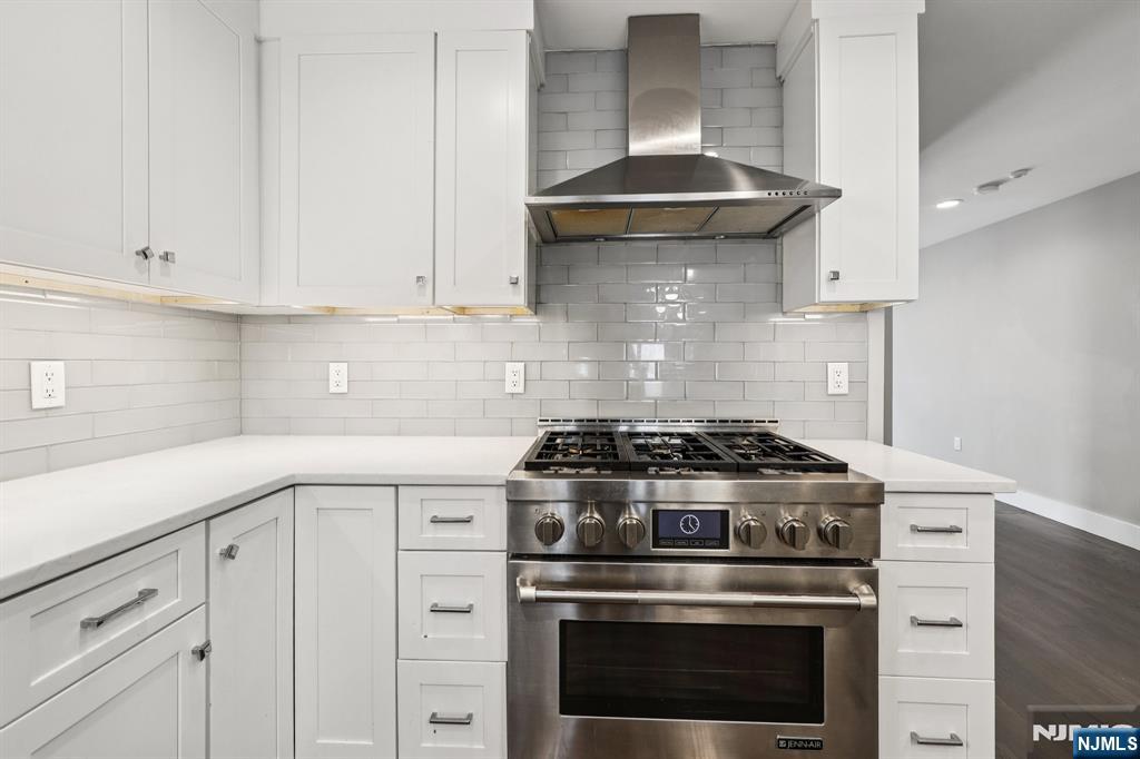 746 Undercliff Avenue, Unit B Edgewater, NJ 07020 - Photo 13 of 50 a stove top oven sitting inside of a kitchen