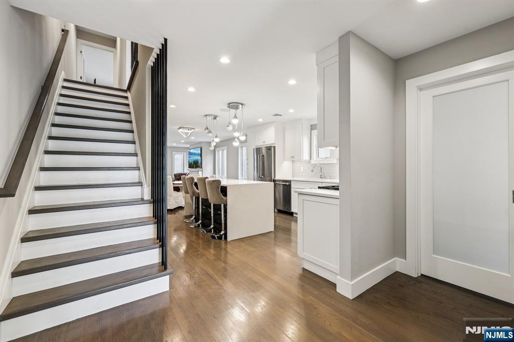 746 Undercliff Avenue, Unit B Edgewater, NJ 07020 - Photo 17 of 50 a view of a room with wooden floor and furniture