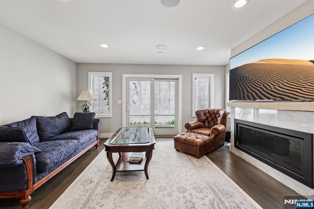 746 Undercliff Avenue, Unit B Edgewater, NJ 07020 - Photo 2 of 50 a living room with furniture and a fireplace