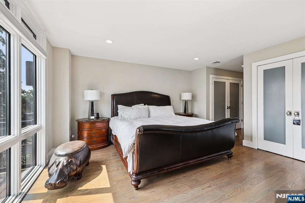 746 Undercliff Avenue, Unit B Edgewater, NJ 07020 - Photo 21 of 50 a bedroom with a bed and wooden floor