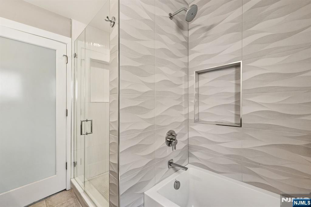 746 Undercliff Avenue, Unit B Edgewater, NJ 07020 - Photo 24 of 50 a bathroom with a bathtub and a shower