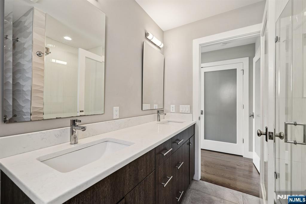 746 Undercliff Avenue, Unit B Edgewater, NJ 07020 - Photo 25 of 50 a bathroom with a sink double vanity and a mirror