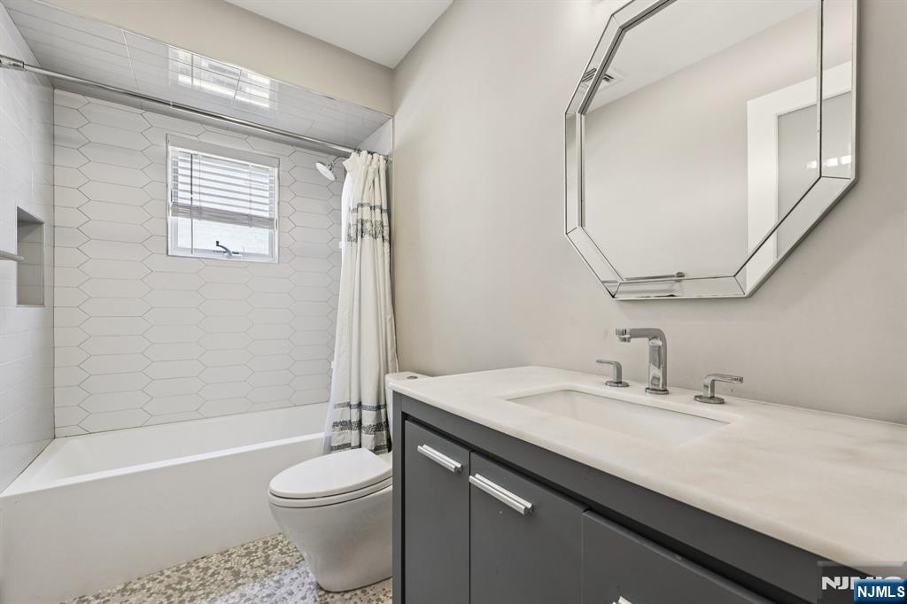 746 Undercliff Avenue, Unit B Edgewater, NJ 07020 - Photo 27 of 50 a bathroom with a sink a toilet and shower