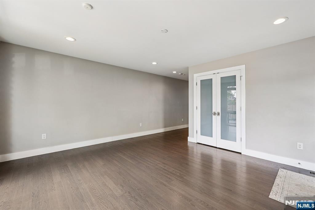 746 Undercliff Avenue, Unit B Edgewater, NJ 07020 - Photo 34 of 50 a view of an empty room with wooden floor