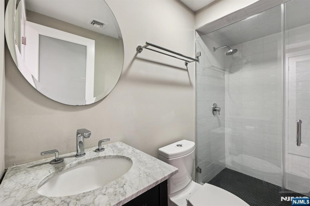 746 Undercliff Avenue, Unit B Edgewater, NJ 07020 - Photo 35 of 50 a bathroom with a sink toilet and shower