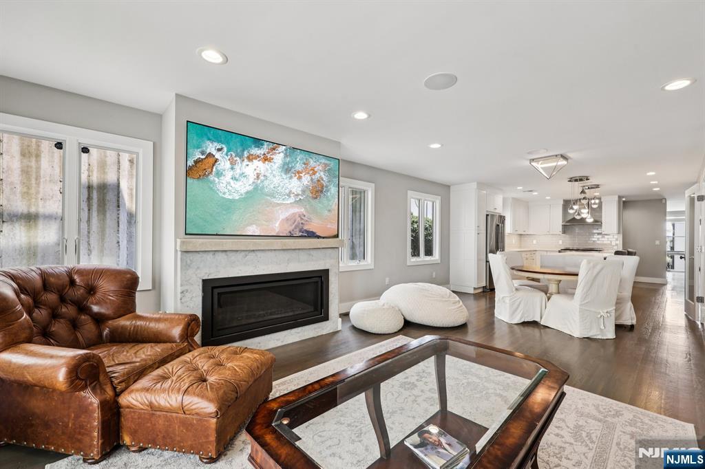 746 Undercliff Avenue, Unit B Edgewater, NJ 07020 - Photo 4 of 50 a living room with furniture and a fireplace