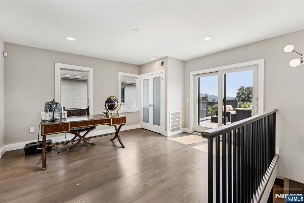 746 Undercliff Avenue, Unit B Edgewater, NJ 07020 - Photo 43 of 50 a living room with furniture a window and wooden floor