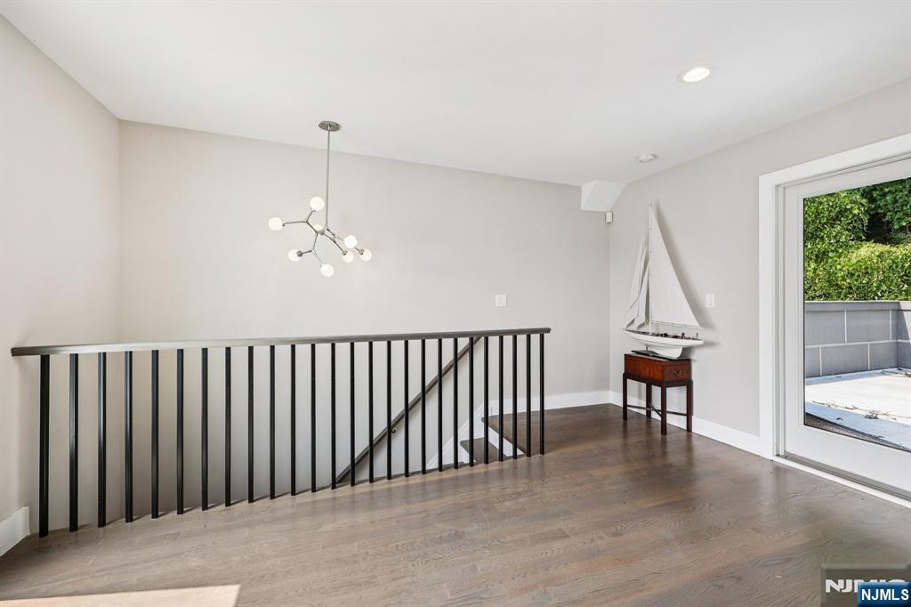746 Undercliff Avenue, Unit B Edgewater, NJ 07020 - Photo 45 of 50 a view of hallway with furniture and a chandelier