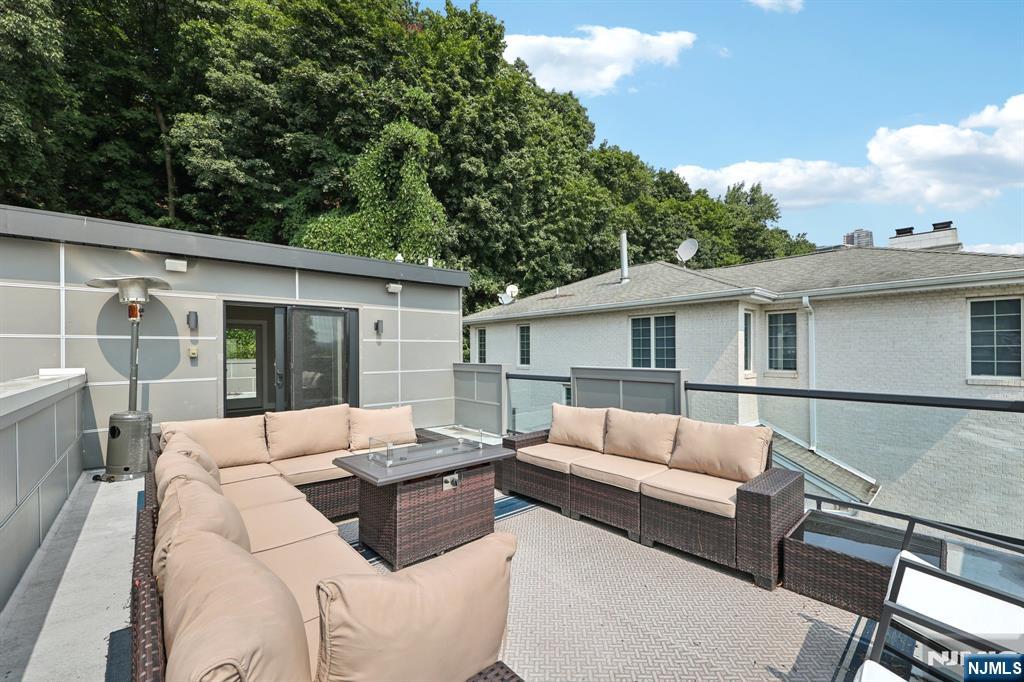 746 Undercliff Avenue, Unit B Edgewater, NJ 07020 - Photo 48 of 50 a view of a house and a couches in the patio