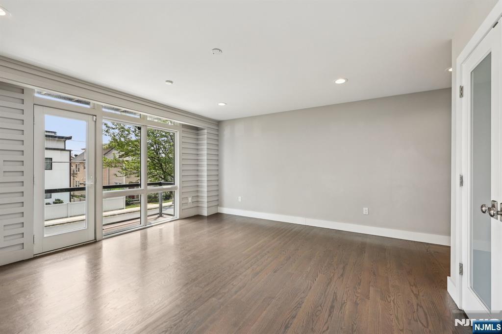 746 Undercliff Avenue, Unit B Edgewater, NJ 07020 - Photo 7 of 50 wooden floor in an empty room with a window
