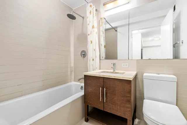 a kitchen with stainless steel appliances a refrigerator and a stove