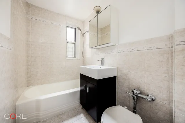 a bathroom with a sink toilet and bathtub