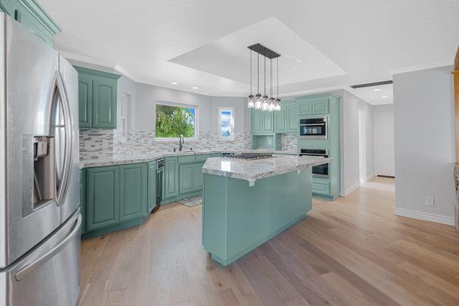 5955 Diablo Hills Road Tres Pinos, CA 95075 - Photo 15 of 91 a kitchen with kitchen island granite countertop a sink cabinets and stainless steel appliances