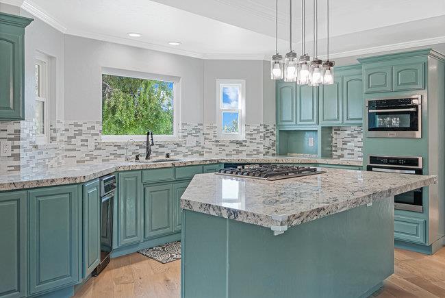 5955 Diablo Hills Road Tres Pinos, CA 95075 - Photo 16 of 91 a kitchen with kitchen island granite countertop stainless steel appliances a sink stove and microwave