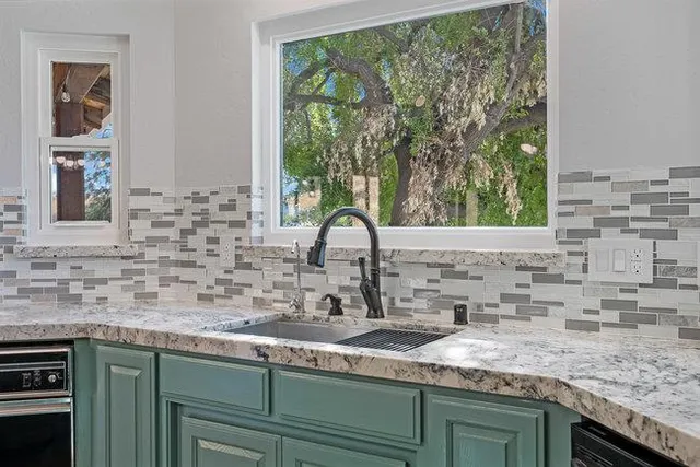 a view of a livingroom with a ceiling fan and window