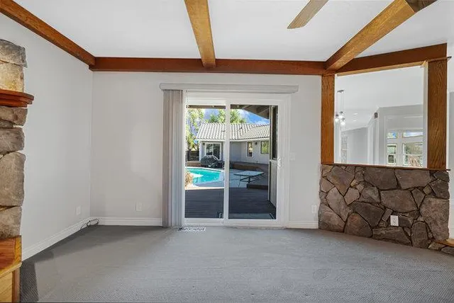 a view of a swimming pool with a lounge chair