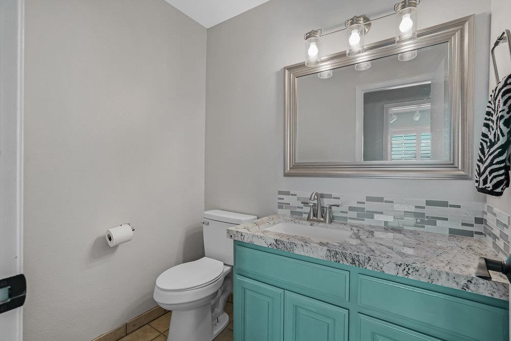 5955 Diablo Hills Road Tres Pinos, CA 95075 - Photo 39 of 91 a bathroom with a granite countertop toilet sink and mirror