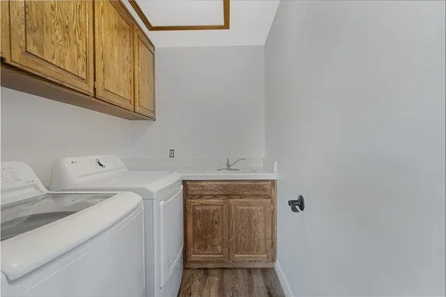 a view of street with wooden fence