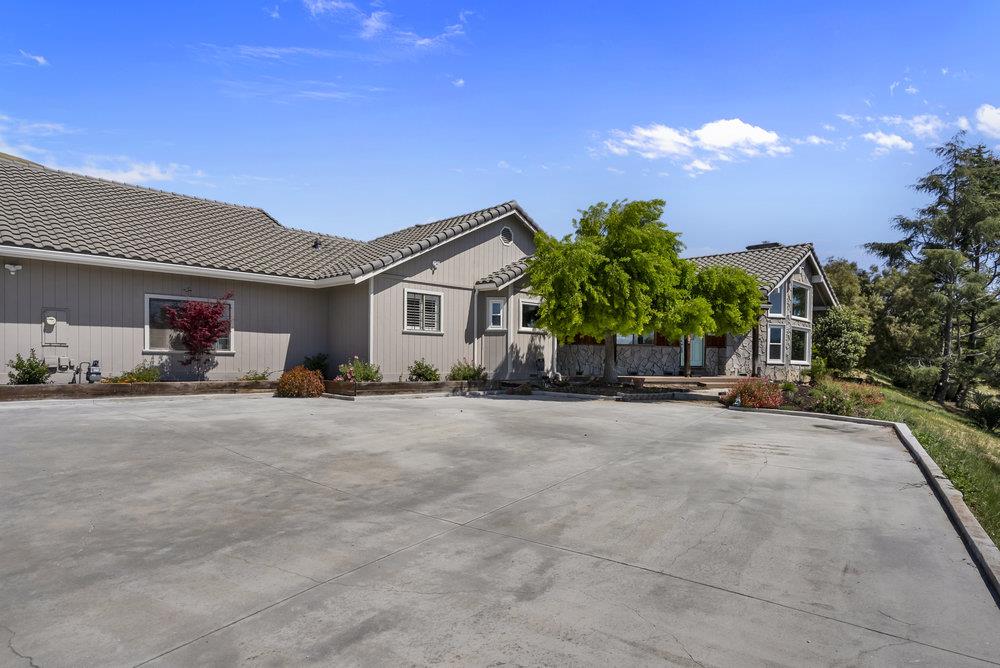 5955 Diablo Hills Road Tres Pinos, CA 95075 - Photo 5 of 91 a view of a house with backyard and a garage