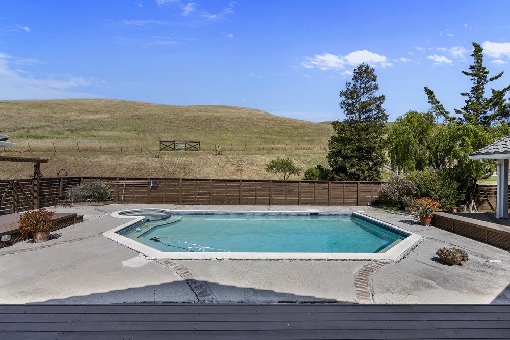 5955 Diablo Hills Road Tres Pinos, CA 95075 - Photo 60 of 91 a view of a swimming pool with a lounge chair