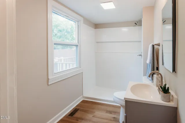a bathroom with a sink and a large mirror