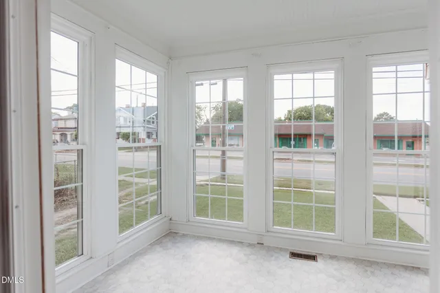 an empty room with a large window