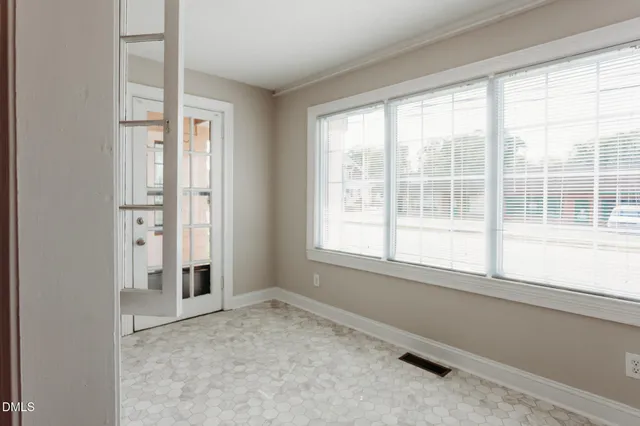 an empty room with windows