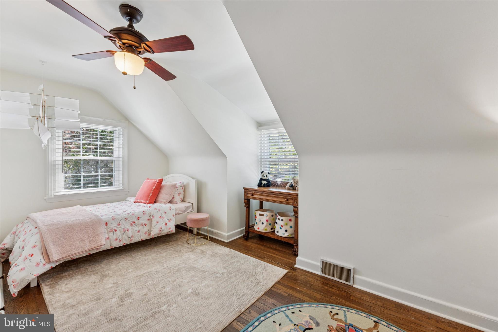447 Conestoga Road Wayne, PA 19087 - Photo 12 of 22 a bedroom with a bed and a chandelier
