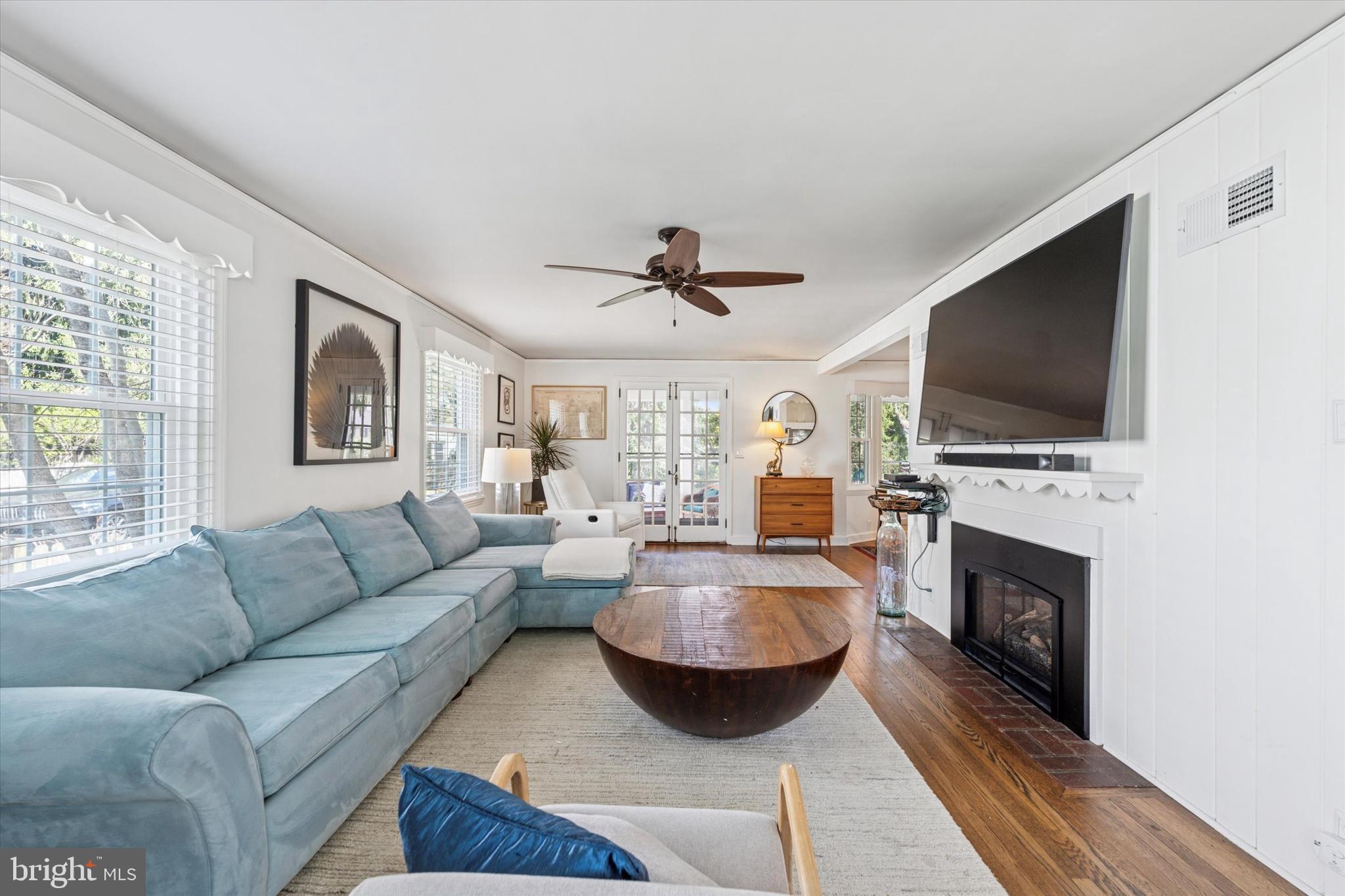 447 Conestoga Road Wayne, PA 19087 - Photo 3 of 22 a living room with fireplace furniture and a flat screen tv
