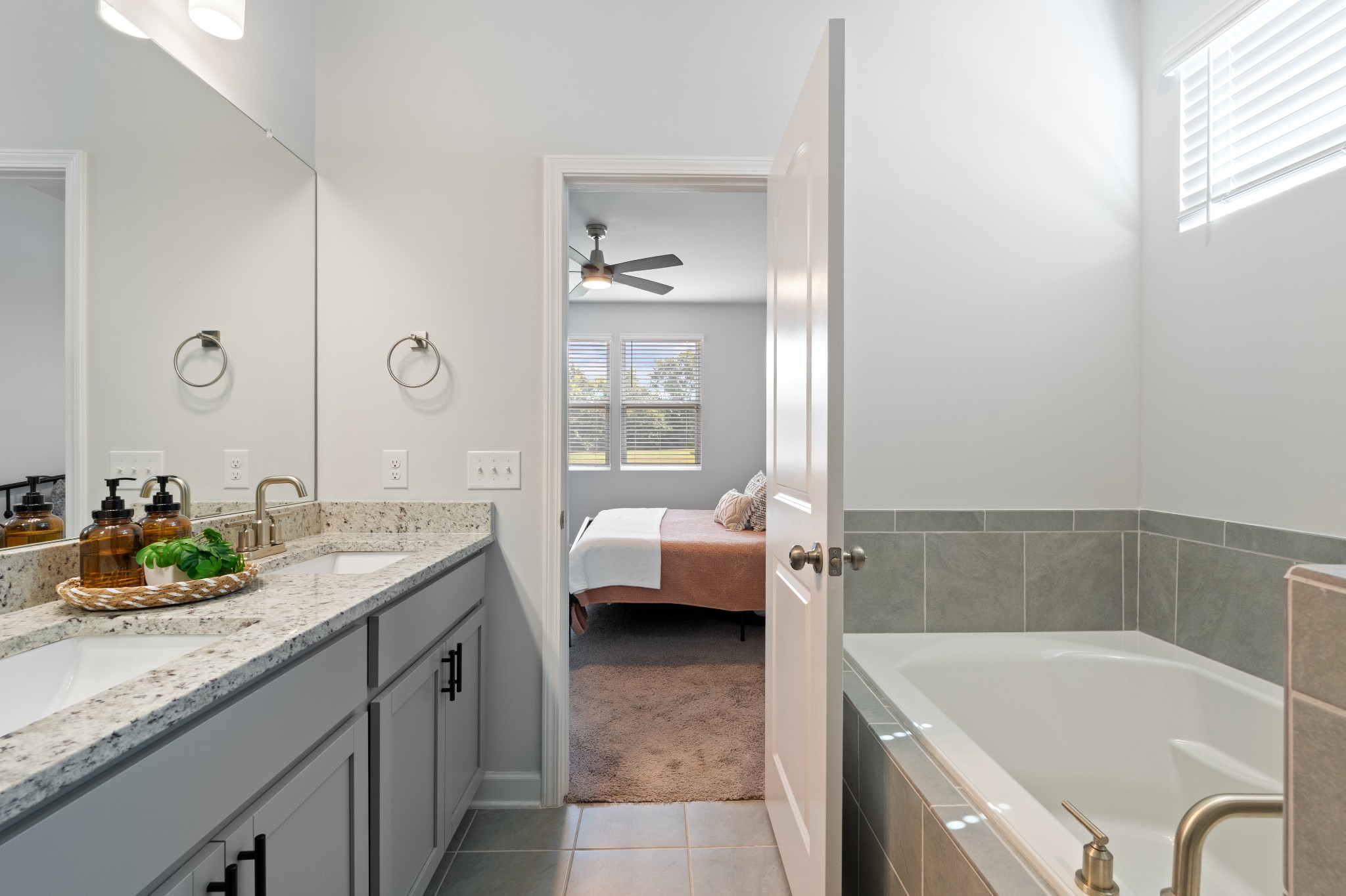 106 Pekka Drive Lebanon, TN 37087 - Photo 12 of 24 a bathroom with a granite countertop tub sink and mirror