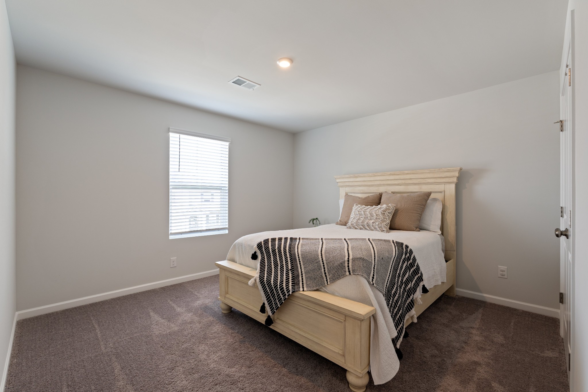 106 Pekka Drive Lebanon, TN 37087 - Photo 16 of 24 a spacious bedroom with a bed and a window