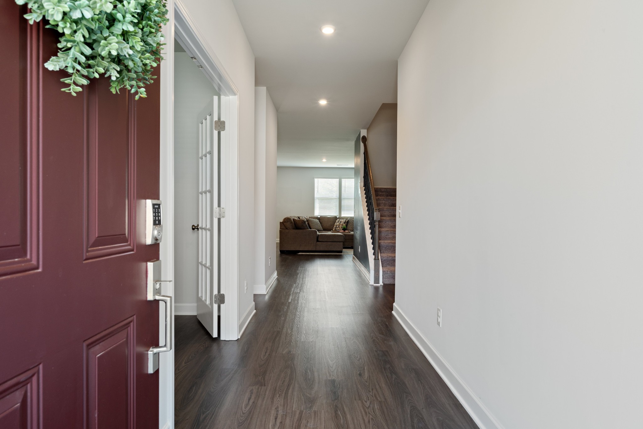 106 Pekka Drive Lebanon, TN 37087 - Photo 3 of 24 a view of a hallway with wooden floor and a living room