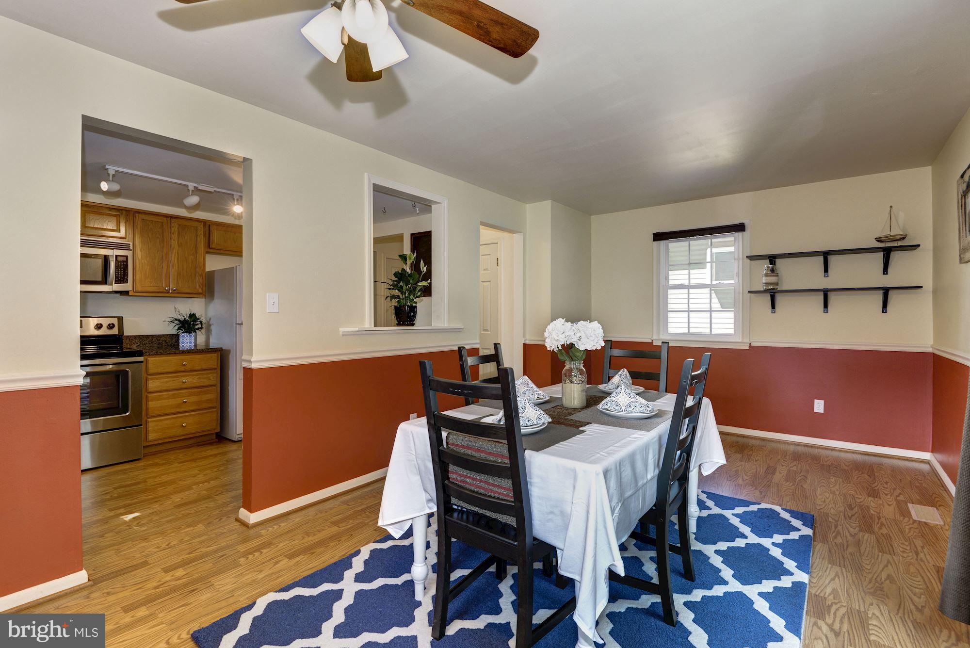 1902 Potomac Road Edgewater, MD 21037 - Photo 9 of 29 a view of a dining room with furniture and wooden floor