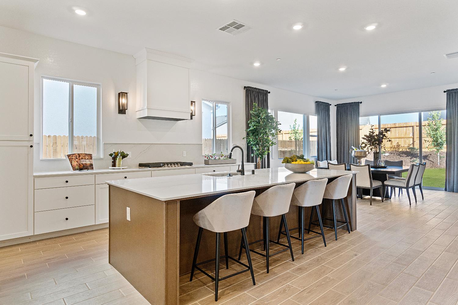 846 Traverse Drive Madera, CA 93636 - Photo 14 of 28 a large kitchen with kitchen island a sink table and chairs