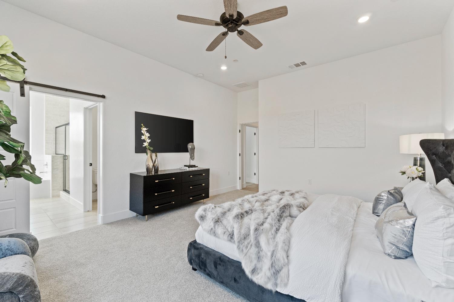 846 Traverse Drive Madera, CA 93636 - Photo 25 of 28 a bedroom with a bed and a flat screen tv