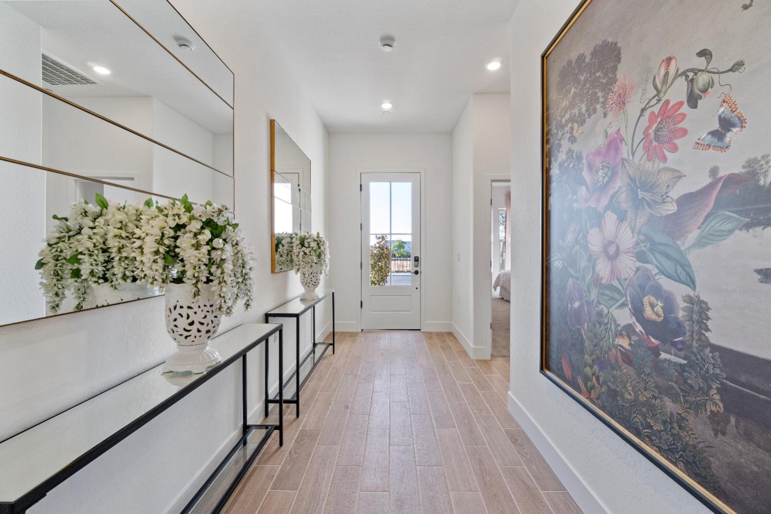 846 Traverse Drive Madera, CA 93636 - Photo 6 of 28 a view of a hallway with wooden floor and staircase