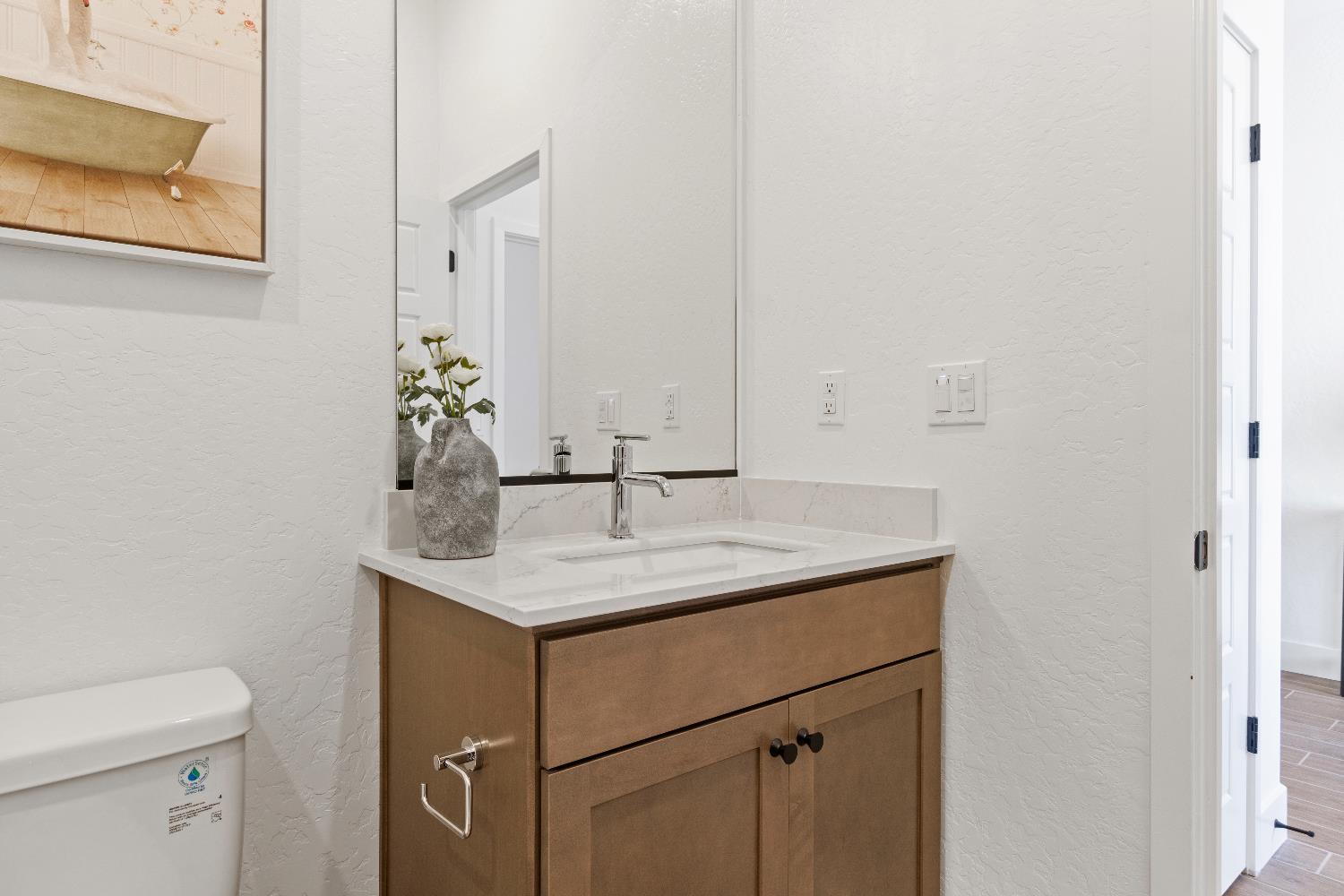 846 Traverse Drive Madera, CA 93636 - Photo 10 of 28 a bathroom with a sink and a toilet