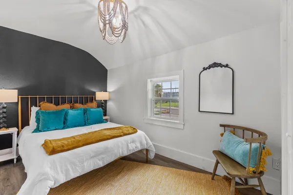 a bedroom with a bed and window