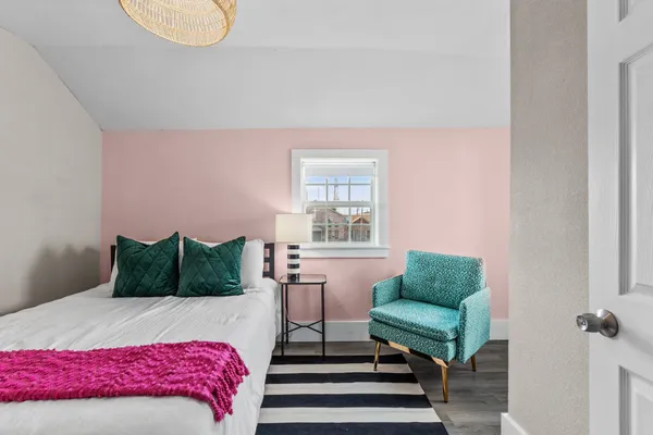 a bedroom with a bed and a couch