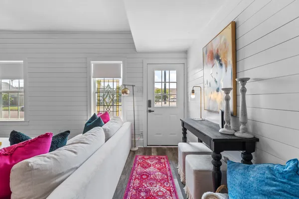 a living room with furniture and a window