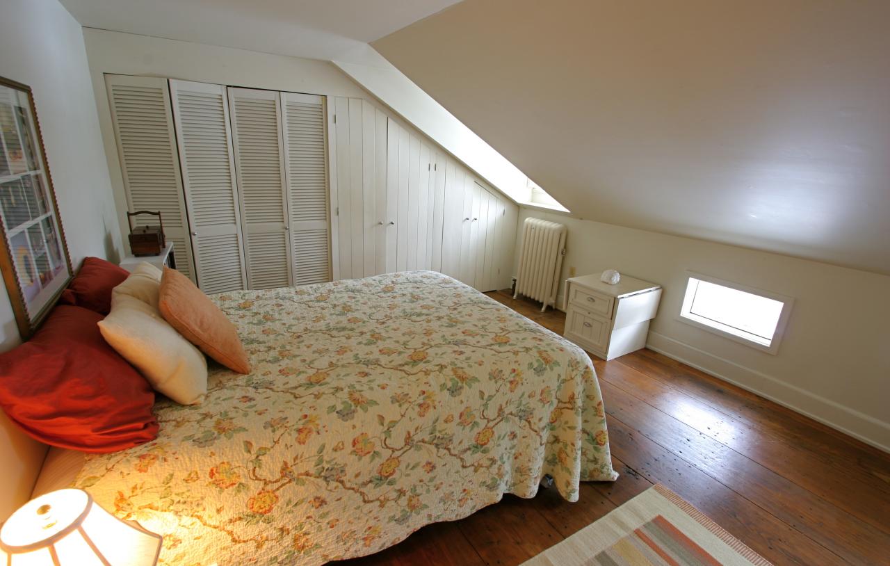 454 Main Road, Unit 8 Monterey, MA 01245 - Photo 12 of 22 a bedroom with a bed and wooden floor