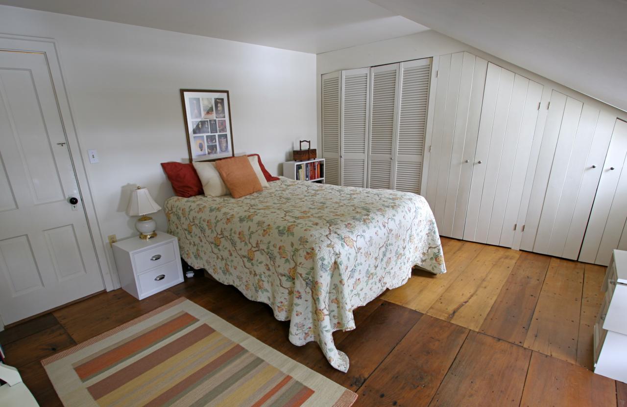 454 Main Road, Unit 8 Monterey, MA 01245 - Photo 13 of 22 a bed room with a bed and a night stand